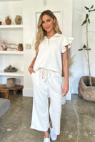 
              Double Take Full Size Texture Ruffle Short Sleeve Top and Wide Leg Pants Set
            