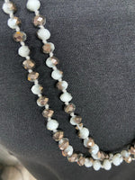 
              White and Grey Hematite Metallic Crystal Bead Necklace
            